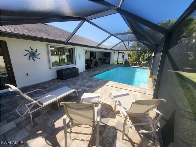 view of pool featuring a lanai and a patio area