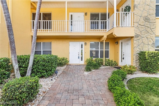 property entrance with a balcony