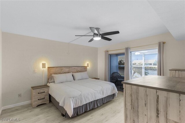 bedroom with ceiling fan and light wood-type flooring