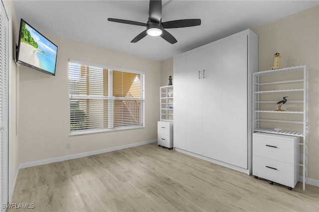 unfurnished bedroom featuring ceiling fan and light hardwood / wood-style flooring