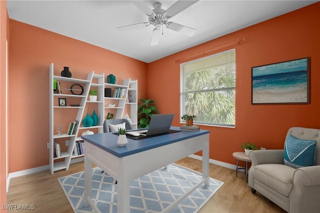 office featuring wood-type flooring and ceiling fan