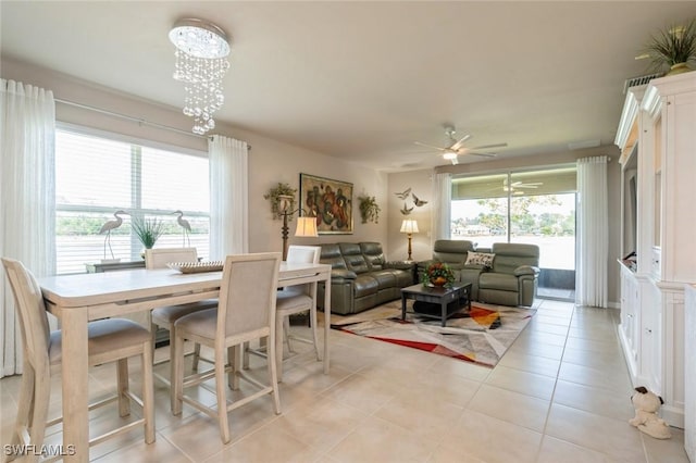 tiled dining area with ceiling fan