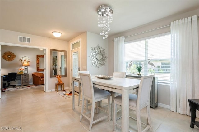 dining room with light tile patterned flooring