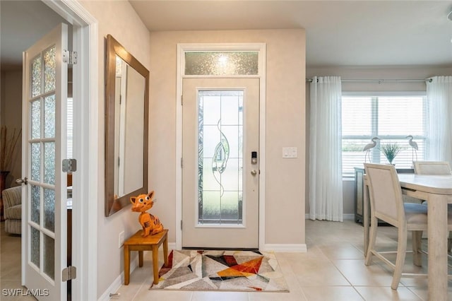 entryway featuring light tile patterned flooring