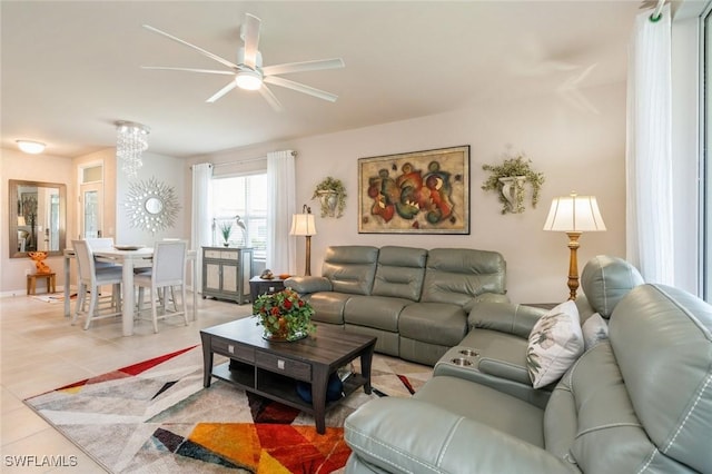 tiled living room with ceiling fan