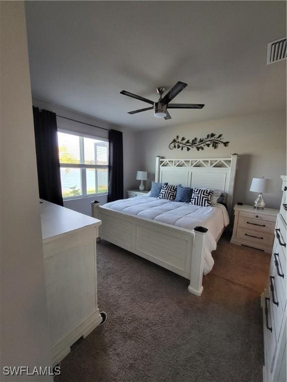 bedroom featuring ceiling fan and dark colored carpet