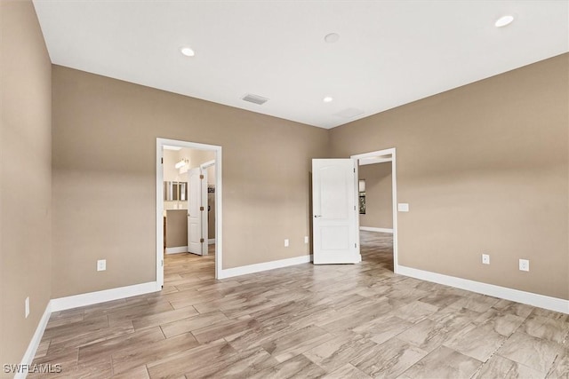 unfurnished bedroom featuring ensuite bathroom