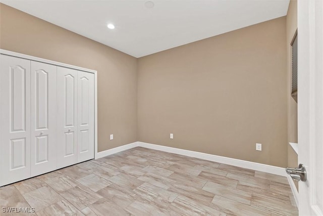 unfurnished bedroom with a closet