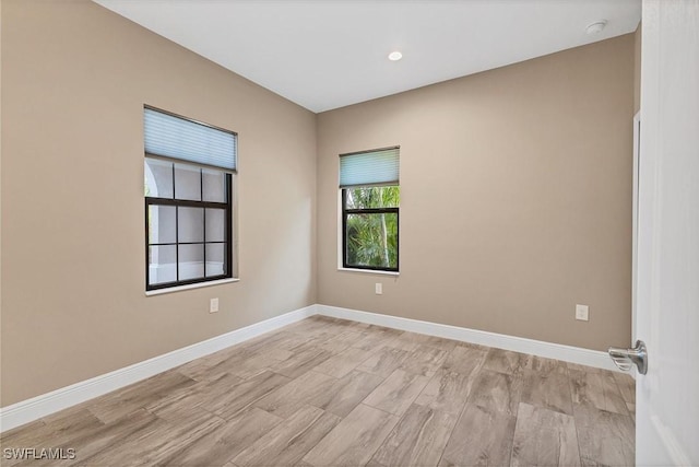 spare room with light hardwood / wood-style floors