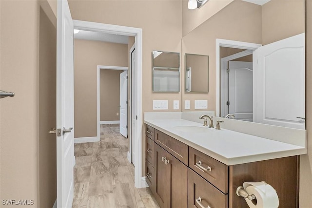 bathroom featuring vanity and hardwood / wood-style floors