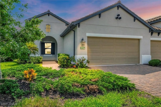 view of front of home with a garage