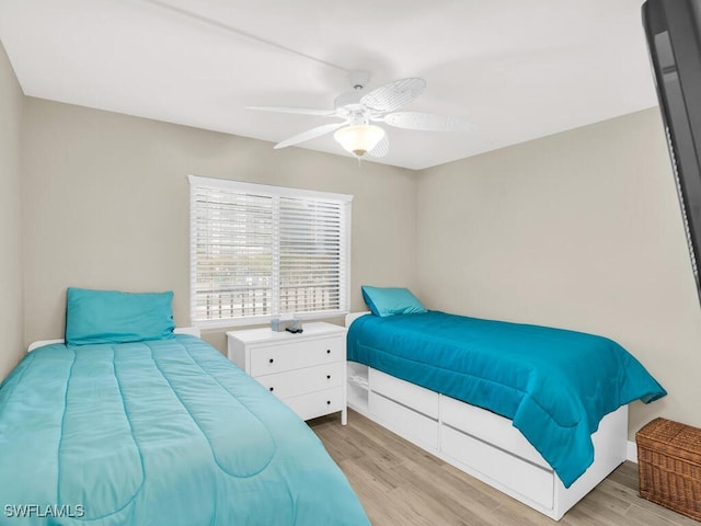 bedroom with ceiling fan and light hardwood / wood-style flooring