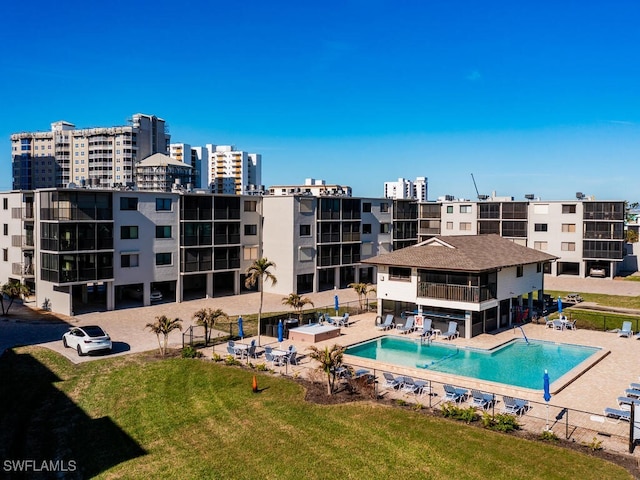 view of swimming pool featuring a lawn and a patio area