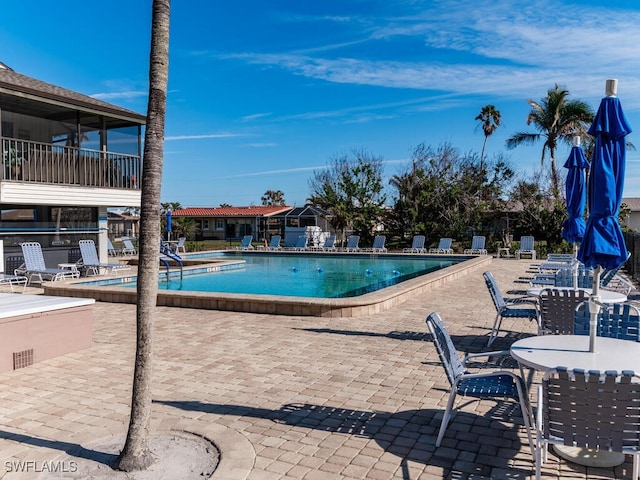 view of swimming pool with a patio area