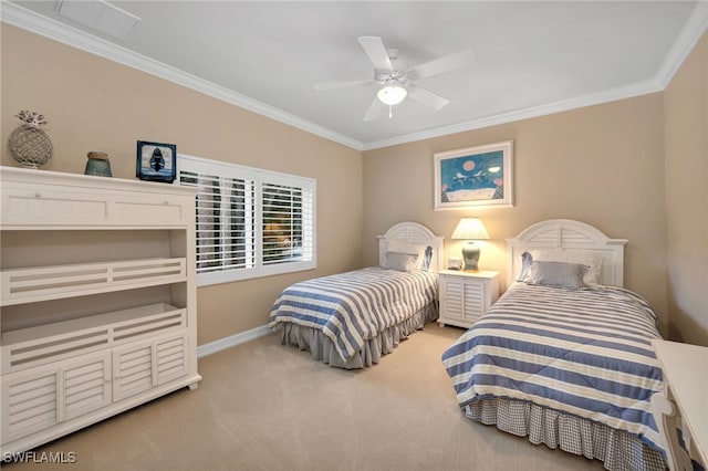 carpeted bedroom with ceiling fan and ornamental molding