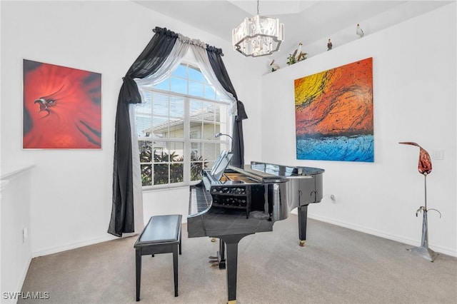 miscellaneous room featuring a chandelier and light colored carpet