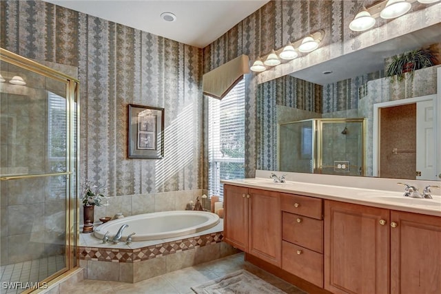 bathroom featuring tile patterned floors, vanity, and separate shower and tub