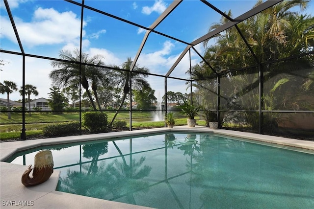 pool with a patio area and glass enclosure