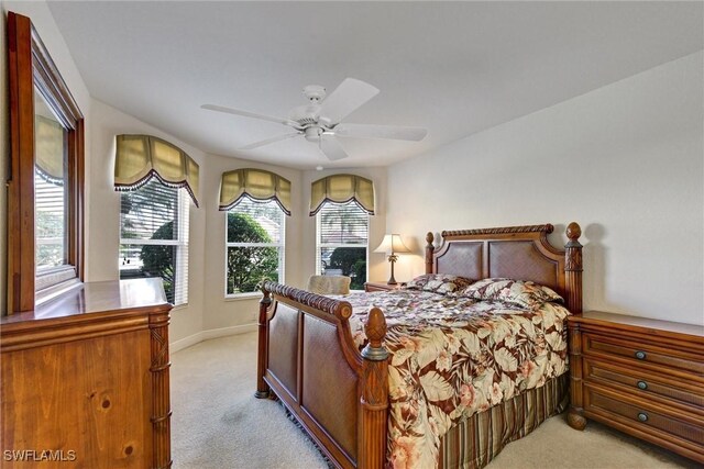 bedroom featuring ceiling fan and light carpet