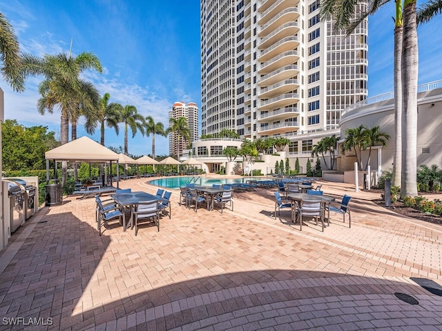 view of swimming pool with a gazebo and a patio area