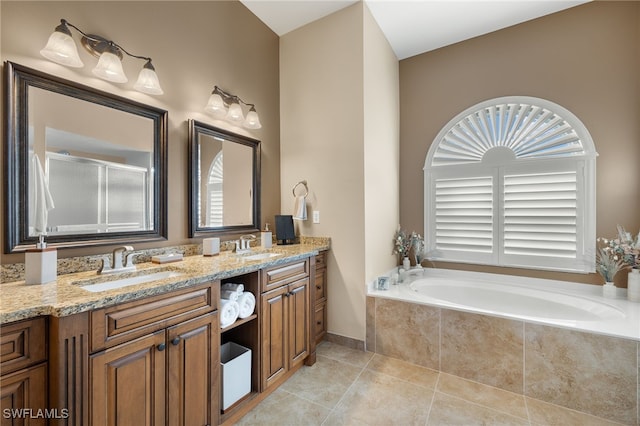 bathroom featuring tile patterned floors, separate shower and tub, and vanity