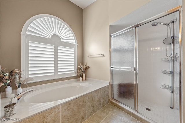 bathroom featuring separate shower and tub and tile patterned flooring