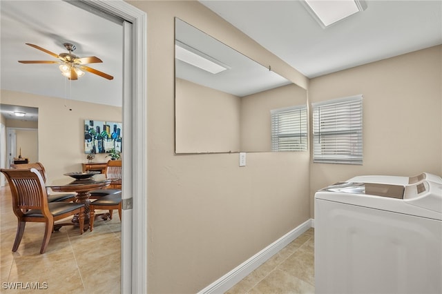 laundry room with light tile patterned floors, washer / dryer, and ceiling fan