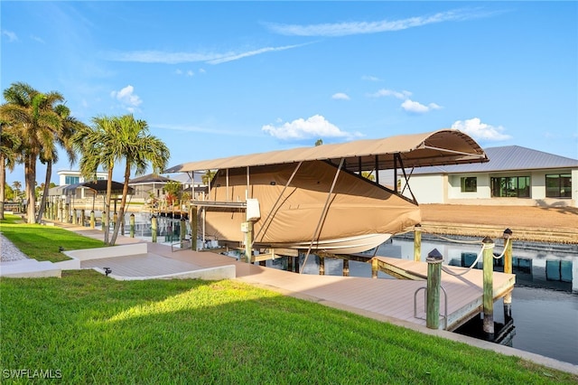 view of dock featuring a yard and a water view