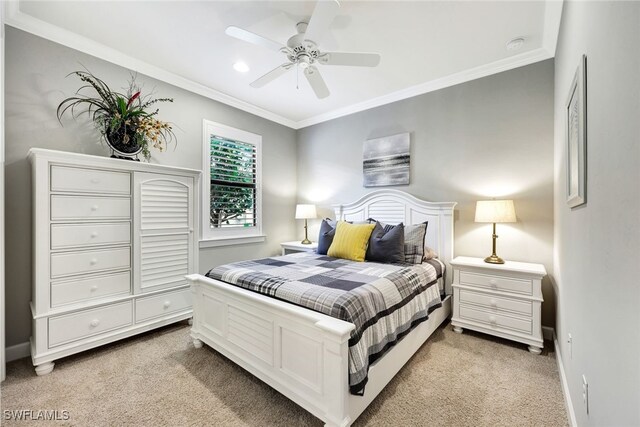 carpeted bedroom with crown molding and ceiling fan