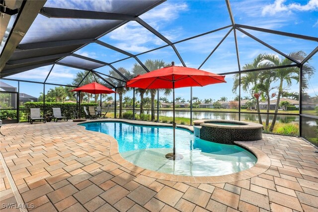 view of swimming pool with a patio area, an in ground hot tub, a water view, and glass enclosure