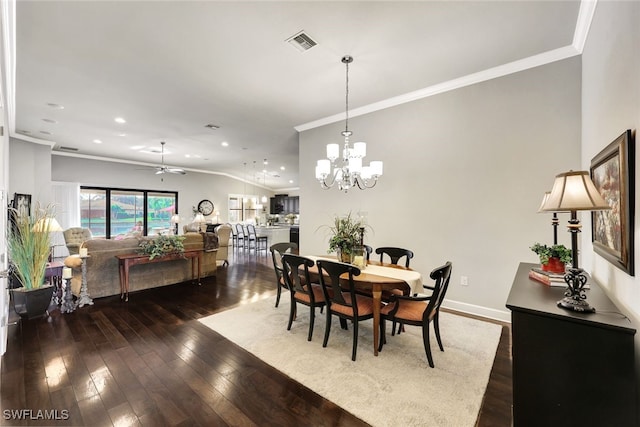 dining space with ornamental molding, vaulted ceiling, ceiling fan with notable chandelier, and dark hardwood / wood-style flooring