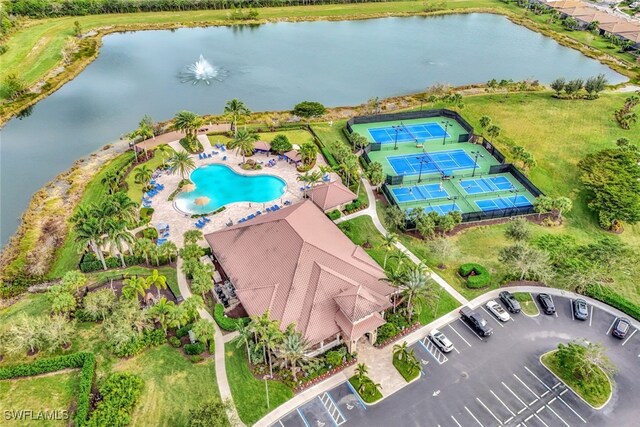 birds eye view of property featuring a water view