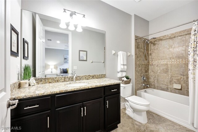 full bathroom featuring tile patterned floors, vanity, toilet, and shower / bath combo