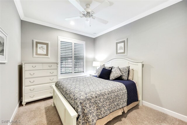 bedroom with ornamental molding, light carpet, and ceiling fan