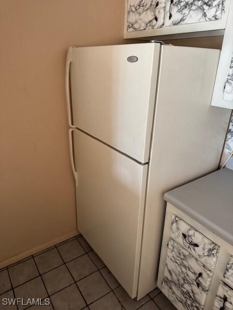 laundry area featuring light tile patterned flooring