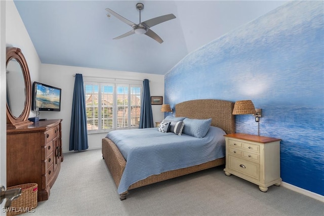 carpeted bedroom with ceiling fan and lofted ceiling