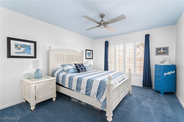 bedroom featuring ceiling fan and dark carpet