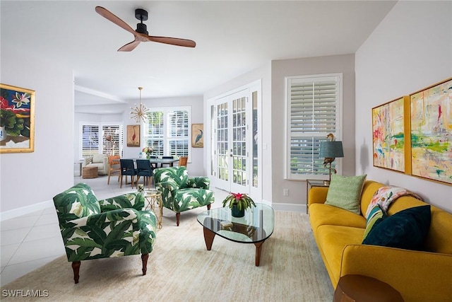 living room with ceiling fan and light tile patterned flooring