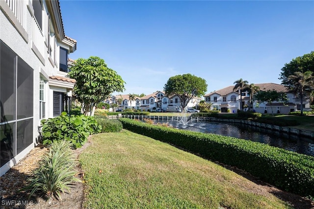 view of yard with a water view