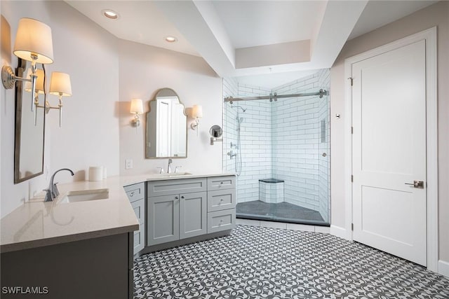 bathroom with vanity and walk in shower