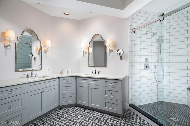 bathroom featuring vanity and a shower with door