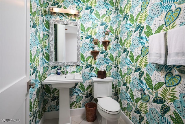 bathroom with tile patterned floors and toilet