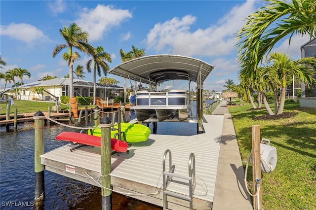 view of dock featuring a lawn and a water view