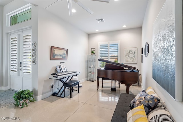 miscellaneous room featuring ceiling fan and light tile patterned floors