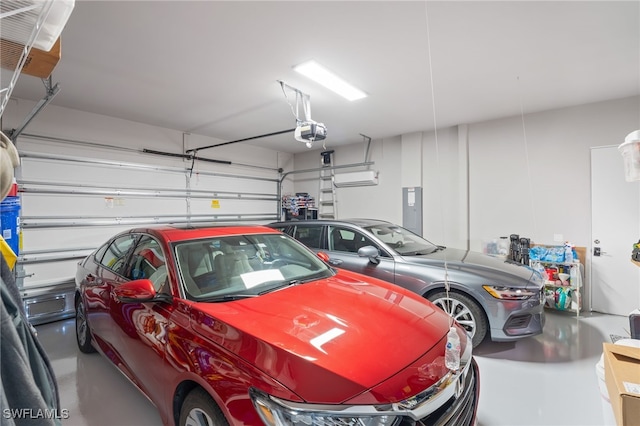 garage featuring a garage door opener and electric panel