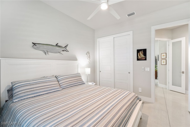 bedroom featuring light tile patterned floors, a closet, and ceiling fan