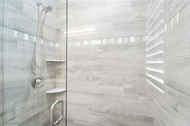 bathroom featuring an enclosed shower