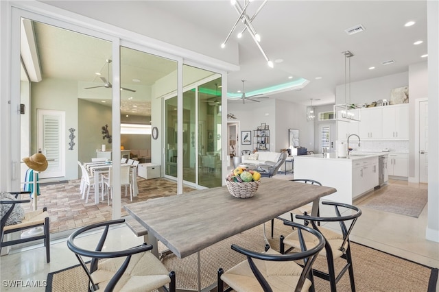 dining area with sink and ceiling fan