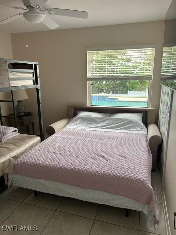 bedroom featuring tile patterned floors and ceiling fan