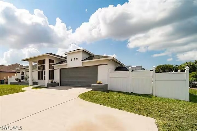 view of front facade featuring a front yard and a garage